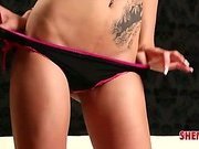 Hot brunette shemale shows off her new tattoo