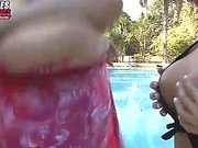 Two blonde trannies fuck next to a beautiful pool