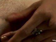 Ebony shemale in purple dress dominates a Caucasian into submission