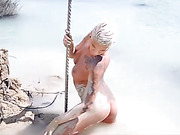 Seductive Danni Daniels posing in mud