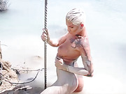 Seductive Danni Daniels posing in mud