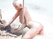 Seductive Danni Daniels posing in mud