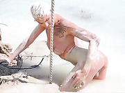 Seductive Danni Daniels posing in mud