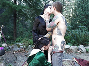 Inked guy fucks two hot tgirls outdoors