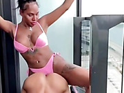 Hung black TS Parris fucks guy all over the apartment