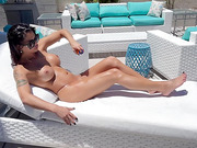 Classy shemale pornstar masturbates and cums in the pool