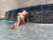 Classy shemale pornstar masturbates and cums in the pool