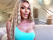 Busty TS temptress strokes her huge hard cock and cums