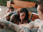 Two heavily inked shemales enjoy fucking a tattooed girl