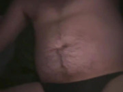 Bed, black thong, purple dildo
