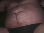Bed, black thong, purple dildo