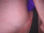 Bed, black thong, purple dildo