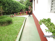 Tanned cute shemale cums outdoors