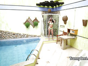 Brunette tranny playing with cock